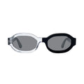 Oversized octagonal sunglasses with a clear transparent frame on the left and a  black frame on the right, featuring dark gray mirror lenses, shown against a plain white background.
