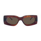 Oversized square sunglasses with a translucent tortoiseshell frame in brown and amber tones, featuring dark brown tinted lenses.