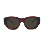 Oversized cat-eye sunglasses with a dark brown tortoiseshell frame and dark tinted lenses, shown against a plain white background.