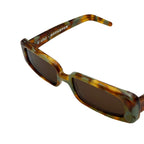 A pair of square sunglasses with a tortoiseshell pattern frame in brown, and green featuring dark brown lenses. set against a plain white background.