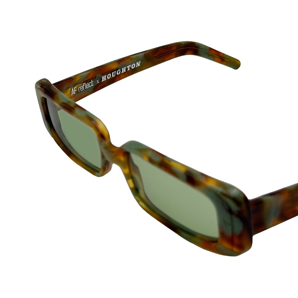 Square sunglasses with a brown and green tortoiseshell acetate frame and light green tinted lenses, set against a plain white background.